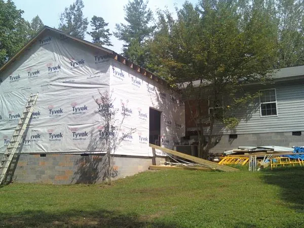 Tyvek wrapped gable on a new room addition beside an existing home in Vancouver